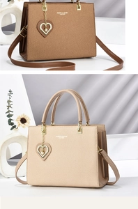 Detail of textured woven tote bags in beige and brown with heart pearl charms