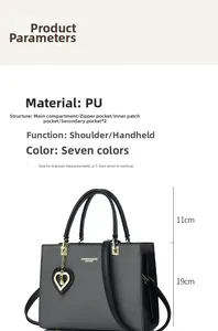 Detail view of woven grey tote bag with heart pearl charm and internal storage sections