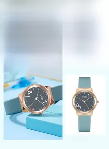 Detail of GEDI quartz watch with rose gold case and minimalist blue silicone strap