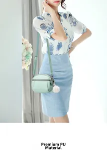 Close-up of mint green quilted PU leather bag with soft texture and white pompom charm