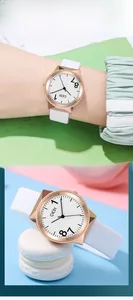 Close-up of GEDI watch featuring rose gold case and large artistic numbers on dial