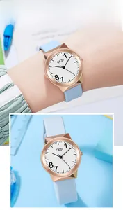 Detailed macro view of light blue silicone jelly watch strap with rose gold polygon case