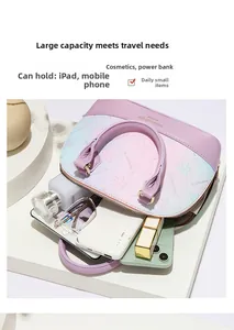 Interior view showing large capacity of purple floral shell bag with daily essentials