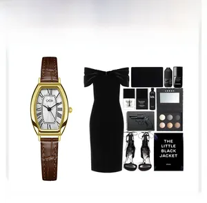 Elegant gold tonneau watch with Roman numerals styled with premium fashion accessories