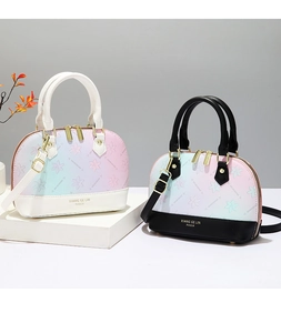 Detail of gradient half-moon shell bags with floral textures and adjustable shoulder straps