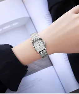 Detailed shot of a GEDI square silver quartz watch with sparkle texture on model's wrist