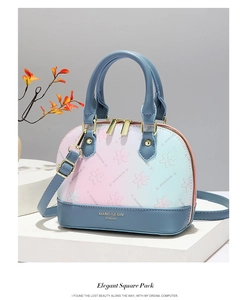 Detailed view of the gradient floral shell bag with golden metal hardware and strap
