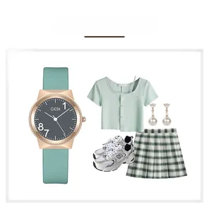 Close-up of mint green silicone strap and gold round case of women's quartz watch