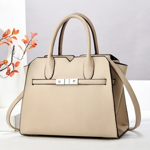 Classic beige textured leather handbag with silver buckles and elegant top handles
