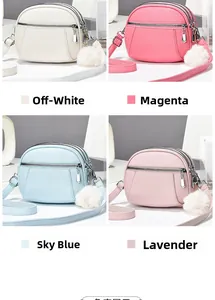 Detail of four colorful crossbody bags with multi-layer zippers and fluffy ball charms