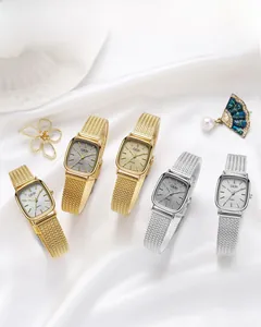 Detail of elegant rectangular women's watch with mesh band and textured dial face