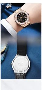 Detail of GEDI watch showing crystal-set bezel and stainless steel engraved back cover