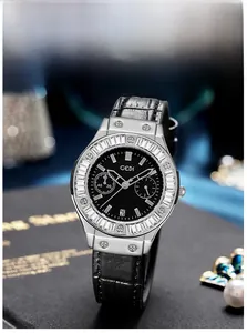 Close-up of luxury GEDI watch with crystal bezel and black crocodile texture leather strap