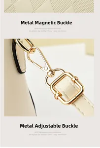 Detailed macro view of the cream leather bag showing glossy gold magnetic buckle and swivel hooks