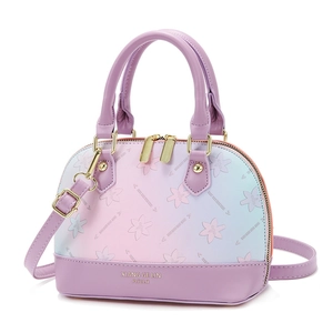 Gradient pink and blue shell handbag with floral prints and gold-tone hardware