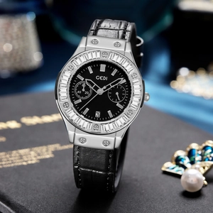GEDI black dial quartz watch with silver rhinestone bezel and black leather strap