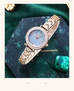 Detailed macro view of the luxury gold alloy watch with blue mother-of-pearl dial
