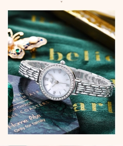 Detail of Gedi silver quartz watch with diamond bezel on elegant green velvet