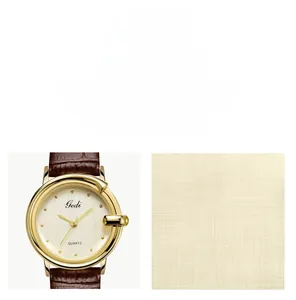 Detail of Gedi ladies watch showing the gold G-shaped case and brown leather strap