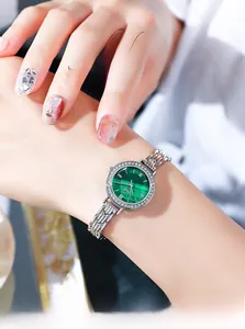 Macro shot of a green malachite watch face with a sparkling rhinestone-set bezel