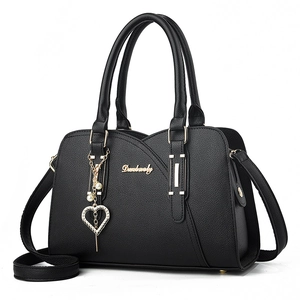 Black pebbled leather handbag for middle-aged women with gold heart charm and top handles