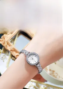 Close-up of Gedi luxury women's silver watch with rhinestone bezel and metal chain strap