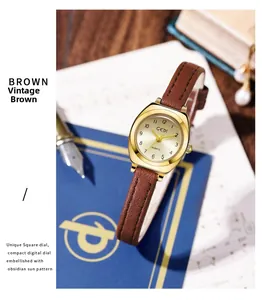 Montre à quartz rétro avec bracelet en cuir marron et boîtier doré sur un bureau