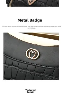 Macro detail of black crocodile embossed leather texture and gold metal logo plaque