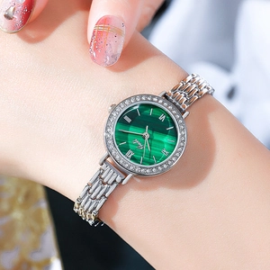 Elegant ladies quartz watch with green malachite dial and crystal bezel on wrist