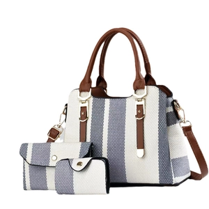 Chic 3-piece bag set with blue striped tote, clutch, and card holder in white background