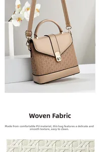 Detailed macro view of high-quality PU leather woven texture and golden clasp on beige bag