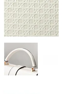 Detail of white woven texture handbag with golden hardware and black edge paint finish