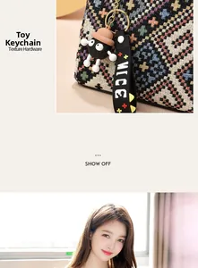 Detail of woven jacquard texture and cute plush doll pendant with gold hardware