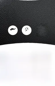 Macro view of black lychee grain leather texture with minimalist fashion typography