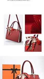 Red wave-textured tote bag with silk scarf detail and premium orange gift box packaging