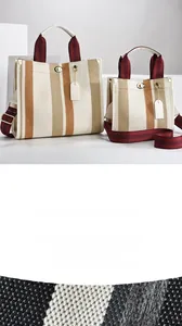 Macro shot of striped woven fabric and white cowhide leather trim on tote bags
