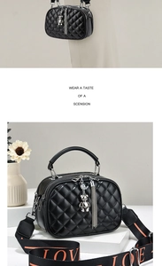 Detail of black quilted crossbody bag featuring dual zippers and wide LOVE strap
