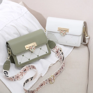 Green and white quilted small square crossbody bags with heart lock and woven strap