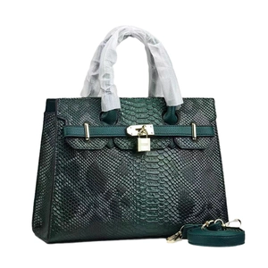 Dark green snake pattern handbag with gold padlock and detachable leather strap