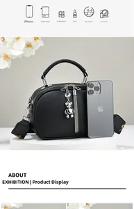 Detail of black pebbled leather mini bag showing storage capacity for daily essentials