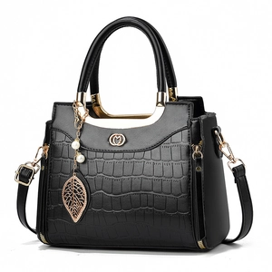 Classic black crocodile texture handbag with gold leaf pendant and pearl charm detail