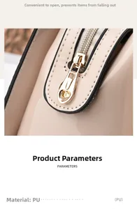 Detailaufnahme des goldenen Herz-Reißverschlusses an beiger Lacklederhandtasche