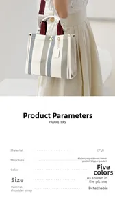 Close-up of striped tote bag with vertical panels, leather handles, and detailed specifications