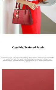 Macro shot of textured red cowhide leather and silk scarf handle on elegant handbag