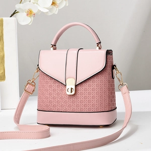 Pink woven PU leather crossbody bag with top handle and gold twist lock for women