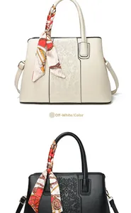 Detailed embroidery and elegant silk scarf handle on stylish tote bags for women