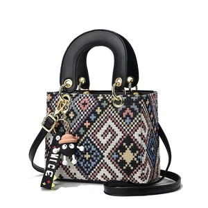 Ethnic style jacquard geometric pattern handbag with leather handles and nice charm