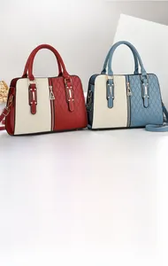 Detail of color-block handbags with diamond quilted texture and vertical zippers