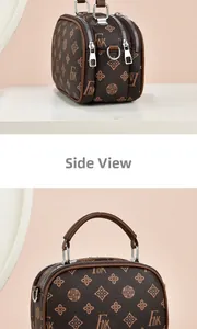 Détail du sac à main vintage marron avec double fermeture éclair et finitions argentées