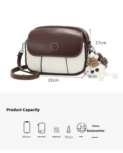 Detail view of the small crossbody bag with dimensions 19x17x8cm and capacity guide